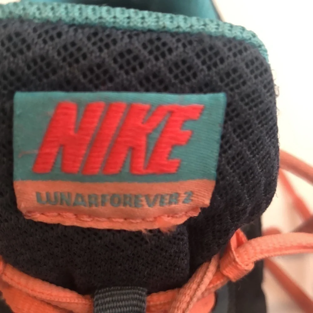 Nike Lunaforever running shoes in dark grey blue peachy colors side swoosh